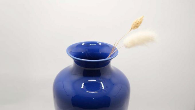 A deep blue elegantly shaped vase