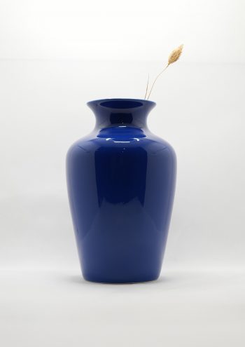 A deep blue elegantly shaped vase