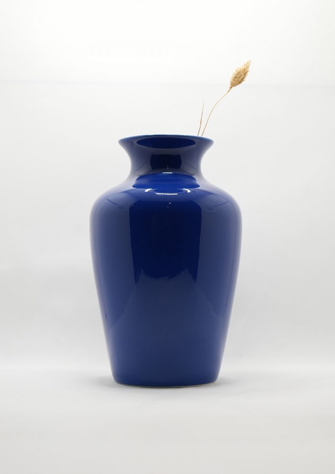 A deep blue elegantly shaped vase
