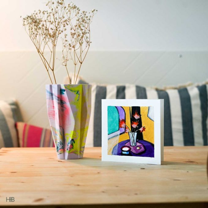 A handpainted art greeting card with a vase of flowers
