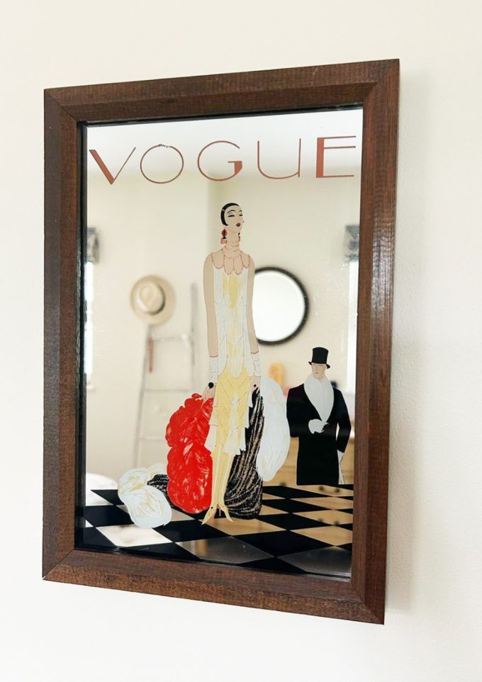 A picture of a vogue mirror on the wall, for sale at The Herringbone Studio